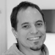 black and white photo of Tamás Cseh, head developer at bookedby.me